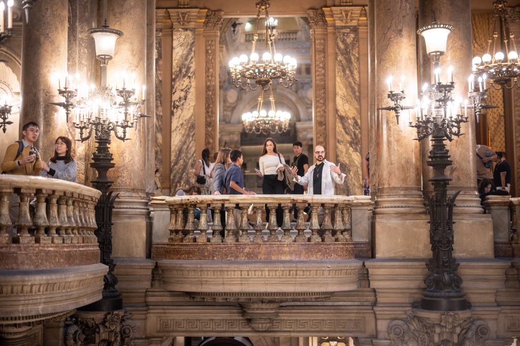 My private paris tour in Opera Garnier Hall, group of people on the balcolny of the Opera in Paris.