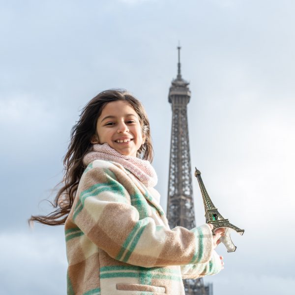 Little girl in front of the Eiffel Tower