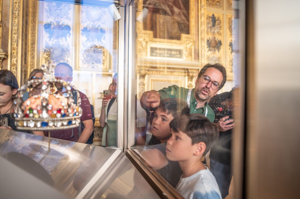 My Private Paris tour guide and co-founder, Bertrand d'Aleman, giving a Louvre Treasure Hunt Private Tour featuring the jewels of Galerie d’Apollon.