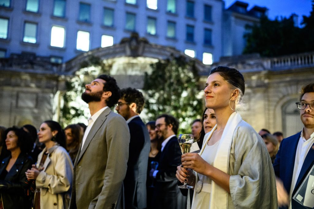 Guests listening to speeches.