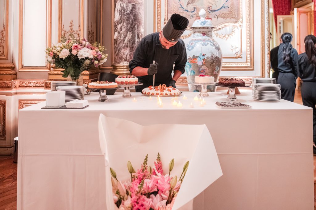 The cutting of the My Private Paris 10 Years cake.