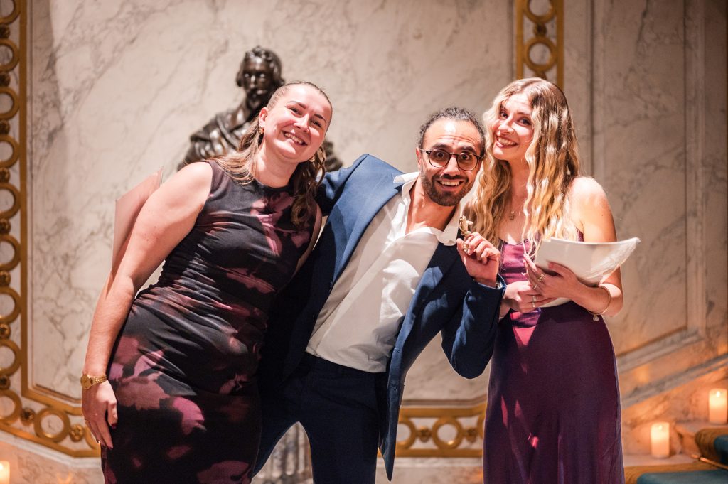 Guide Manu receiving his award.