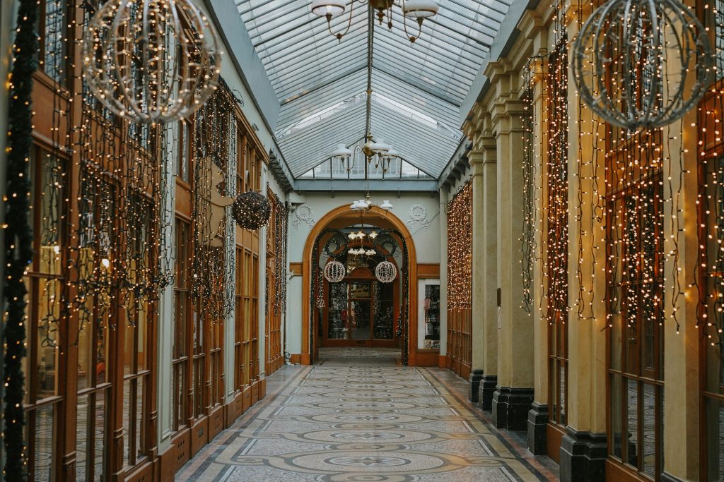 Delicate lights hanging along the Galerie Vivienne in wintertime Paris.