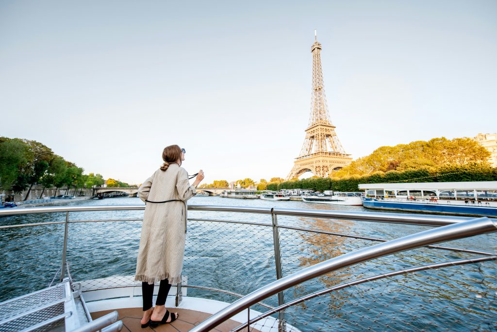 Women on a river boat cruise paris my private paris sunny day Eiffel tower