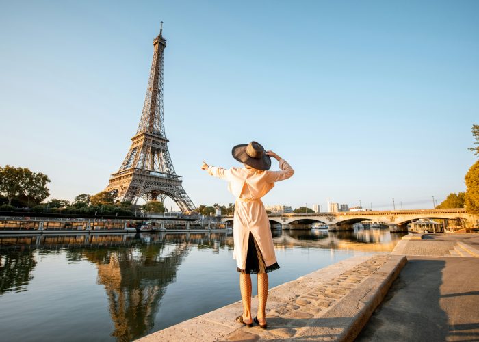 Women in front of Eiffel Tower during Summer.