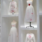 dcps-chloe-GvNF0ezTOU0-unsplash The Dior Gallery in Paris museum with display of Dior's white dresses with red details.My private paris Fashion Tour Paris