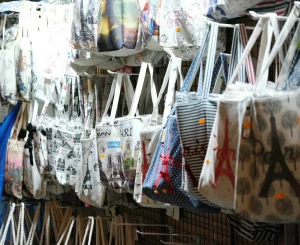 Paris Gift shop selling Paris-themed tote bags.