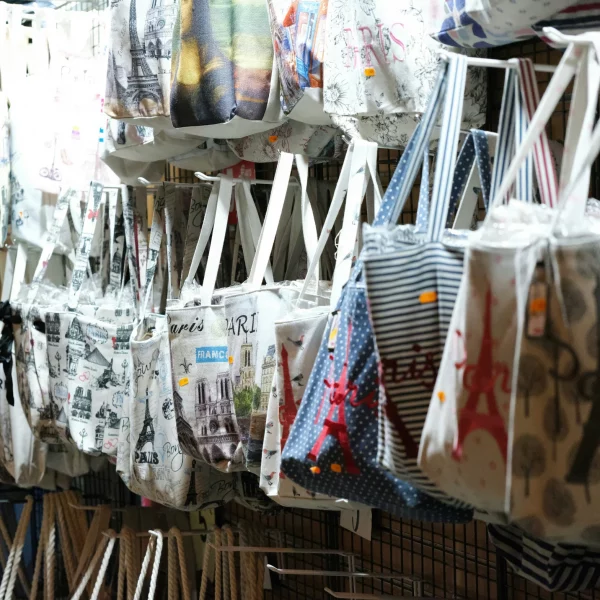 Paris Gift shop selling Paris-themed tote bags.