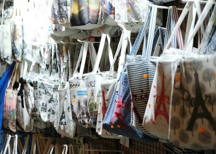 Paris Gift shop selling Paris-themed tote bags.