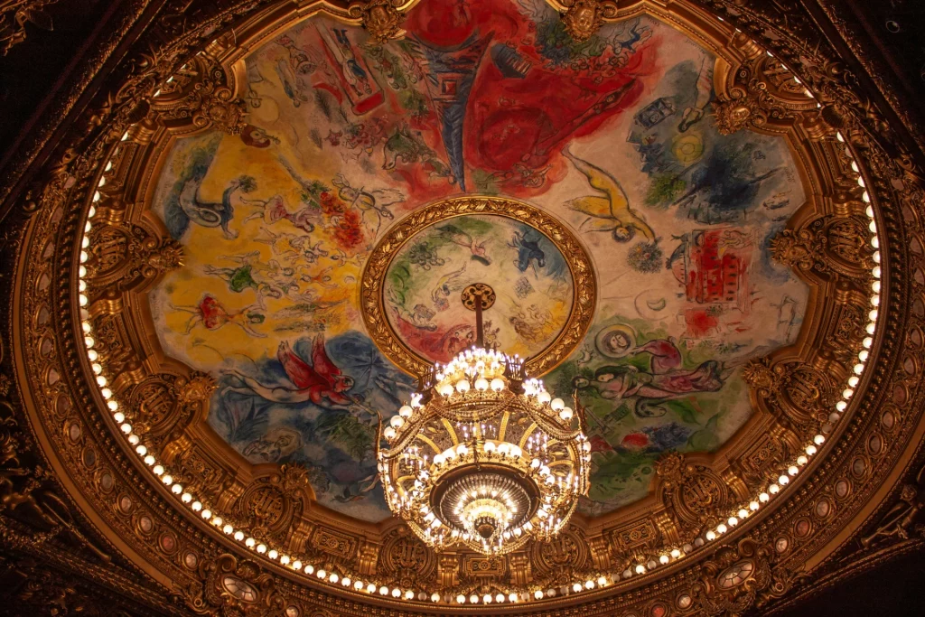 Opera Garnier Chagall Ceiling in Paris. Colorfull. With a gold chadelier.