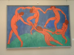 The Dance, a painting created by Matisse in 1910. With persons dancing in cercle, blue and orange in the painting.