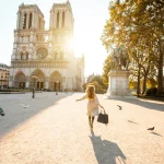 Woman exploring the area around Notre-Dame Cathedral in Paris.