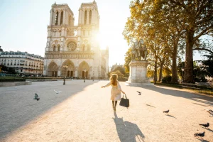 Woman exploring the area around Notre-Dame Cathedral in Paris.