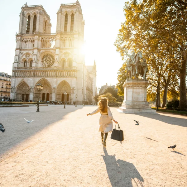 Woman exploring the area around Notre-Dame Cathedral in Paris.