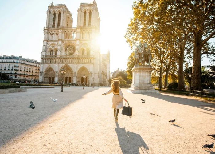 Woman exploring the area around Notre-Dame Cathedral in Paris.