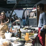 marche-des-enfants-rouges-paris Food vendors serving customers at the Marché des Enfants Rouges, Paris.